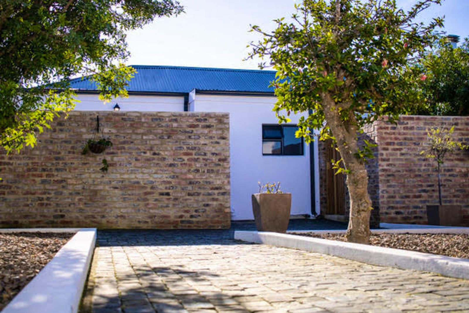 Cobbled courtyard with brick walls